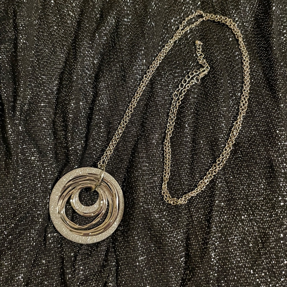 Sparkling, silver-tone, long necklace with dangling, glittering, circles.
